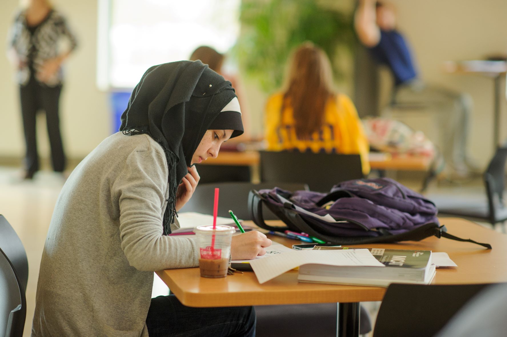 student on laptop in rotunda