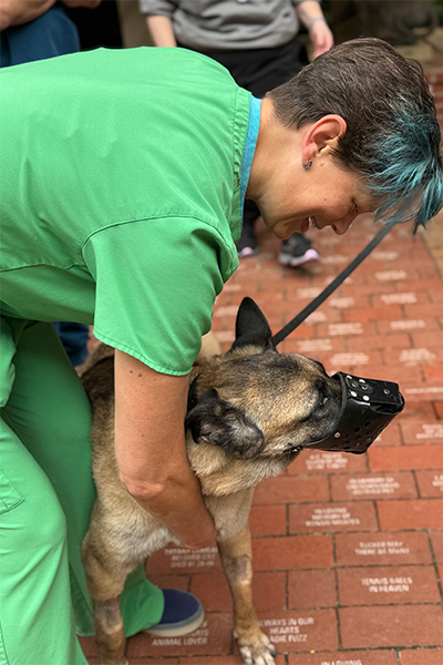 Dr. Patty Lathan pets Astra